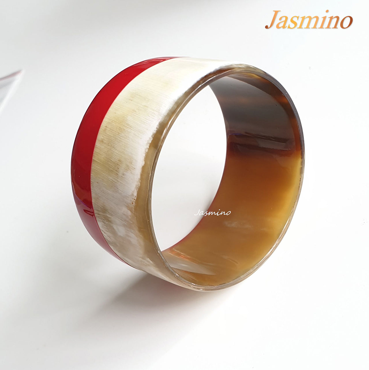 round red lacquer buffalo horn bracelet on the light background, unique gift for her