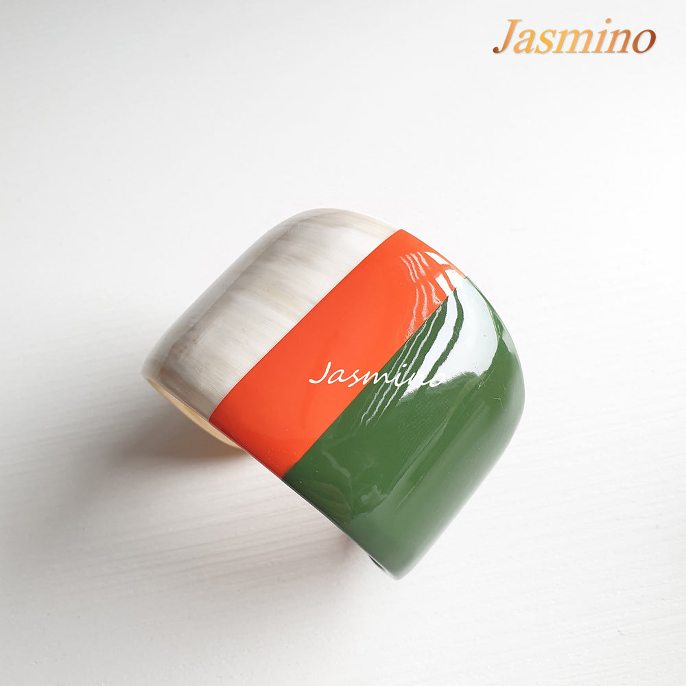 
                  
                     orange peel- dark green lacquer buffalo horn bracelet on the light background, impressive Christmas gift for her
                  
                