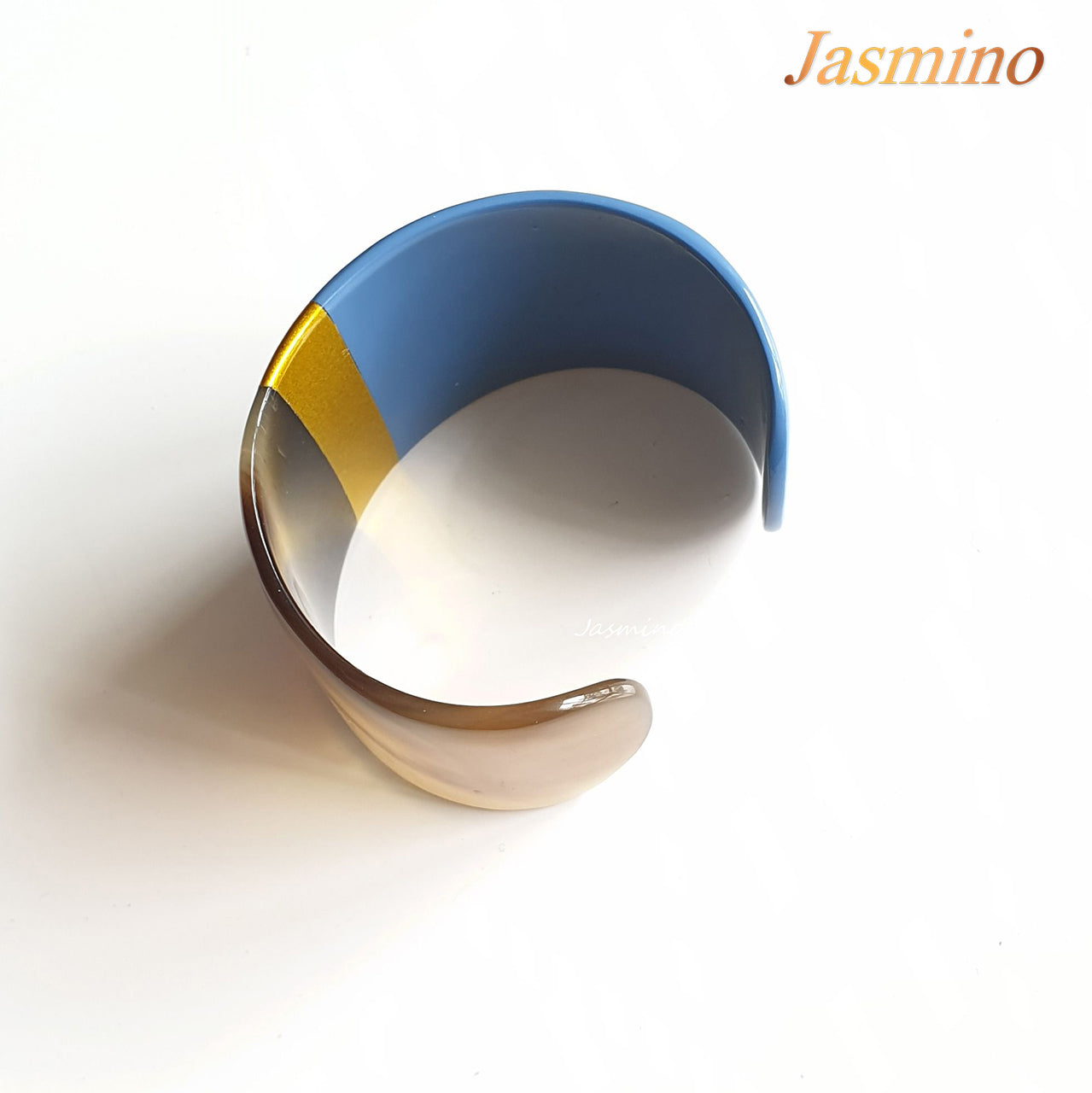 bronze- azure blue lacquer buffalo horn bracelet on the light background, impressive gift for her