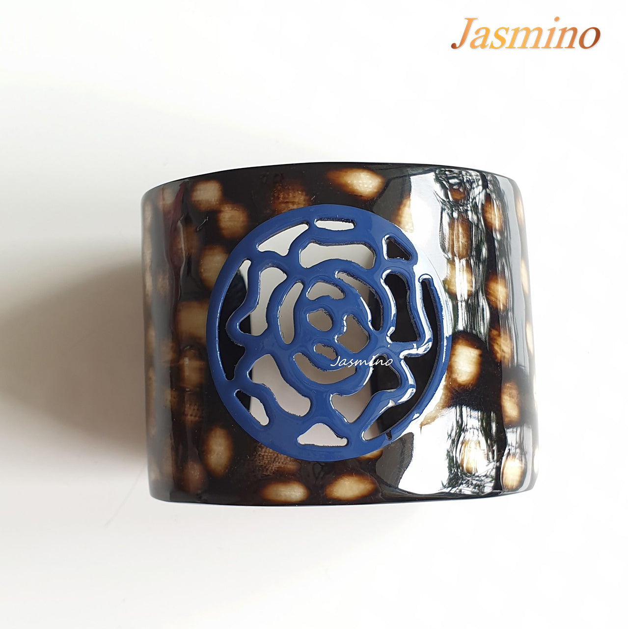 unique dark buffalo horn bracelet with a unique princess blue flower pattern on a light background, an impressive gift for her