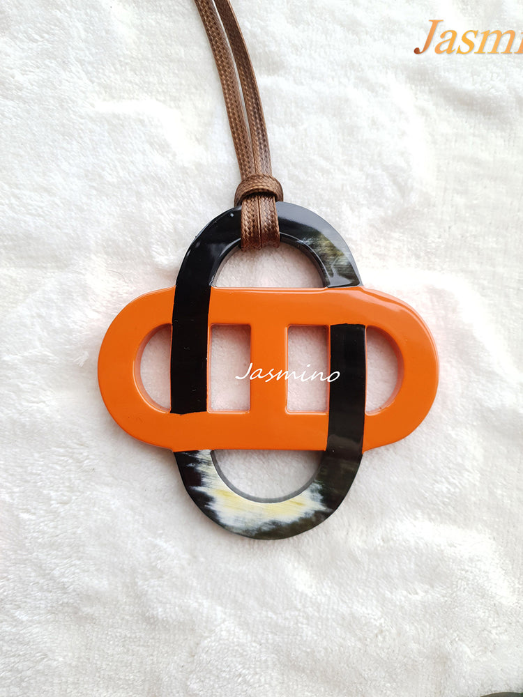 
                  
                    orange lacquer pendant on the light background, impressive gift for her
                  
                