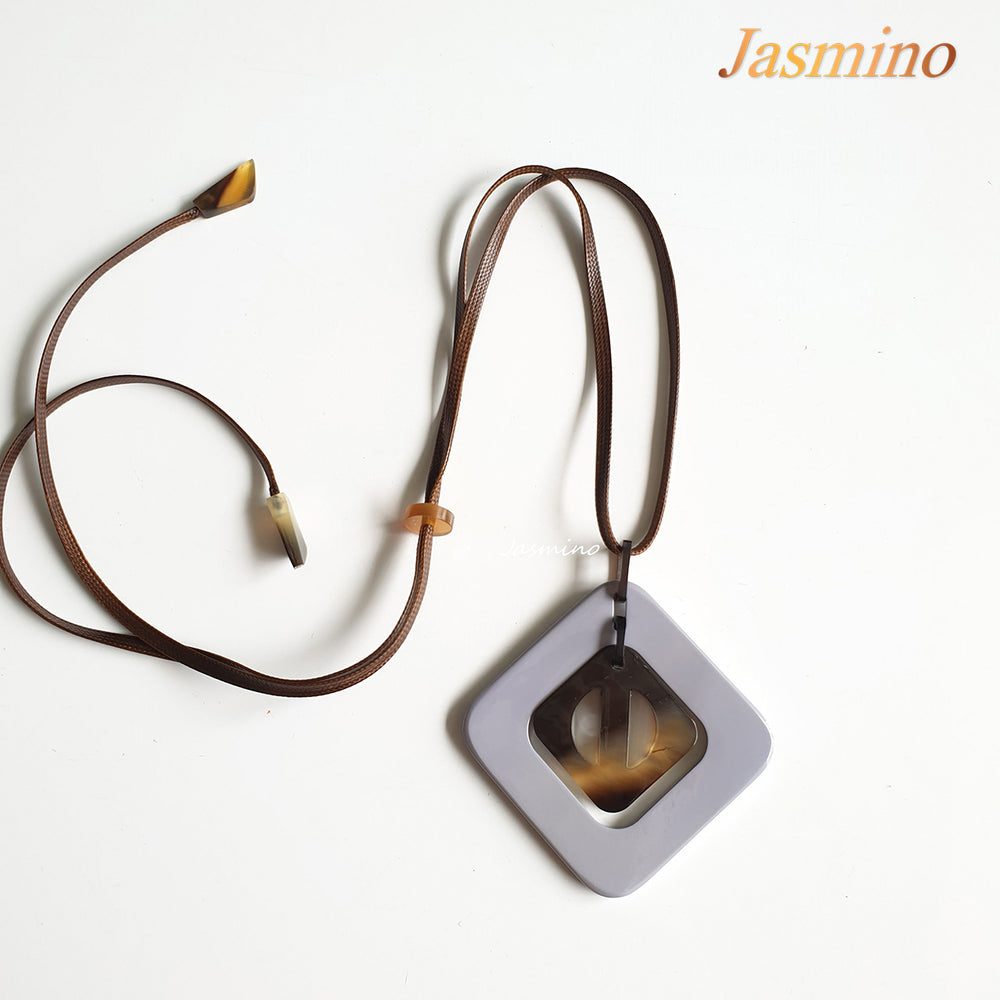 
                  
                    purple rhombus pendant on the light background, impressive gift for her
                  
                