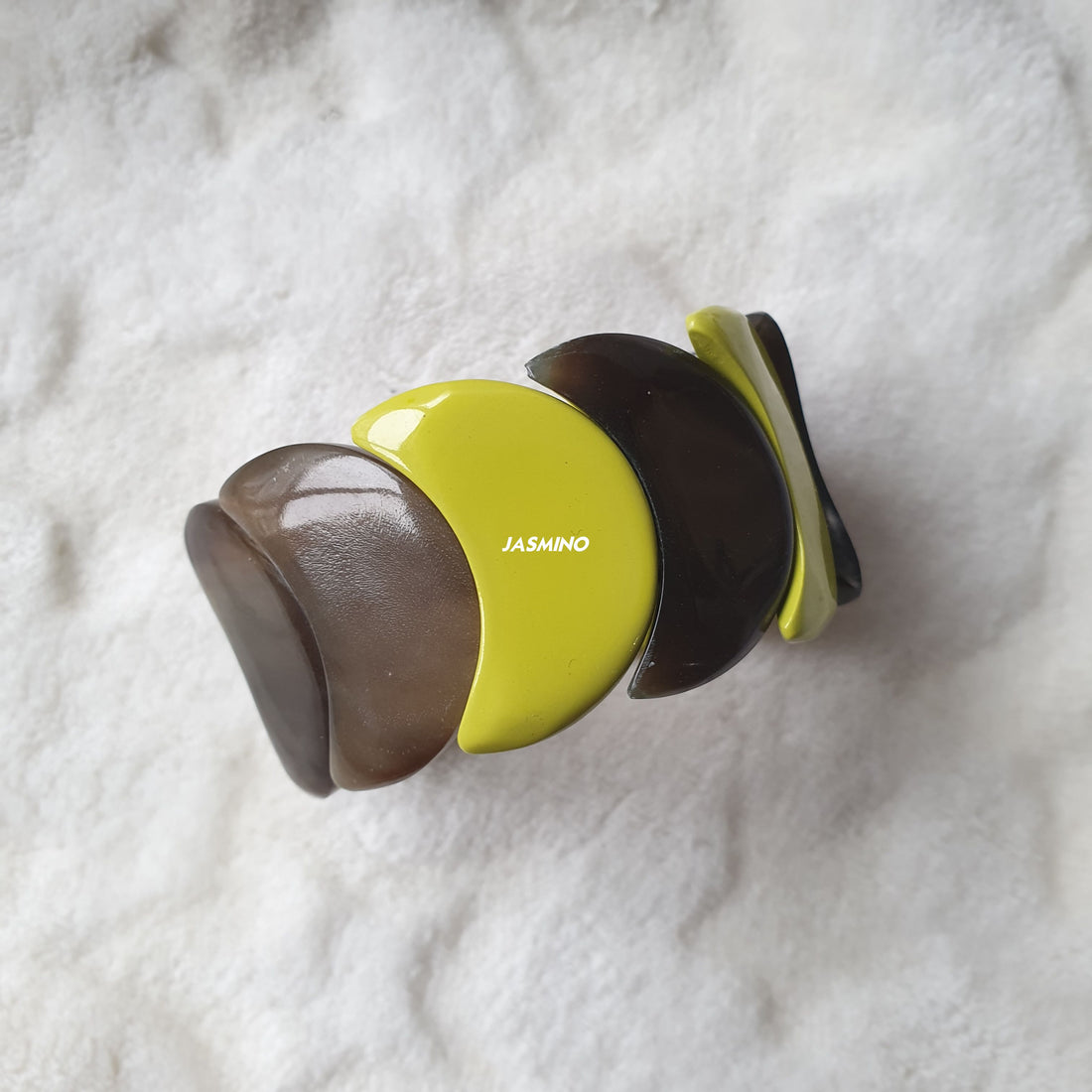 handmade bangle bracelet features black and lime green in natural buffalo horn for Spring 2023