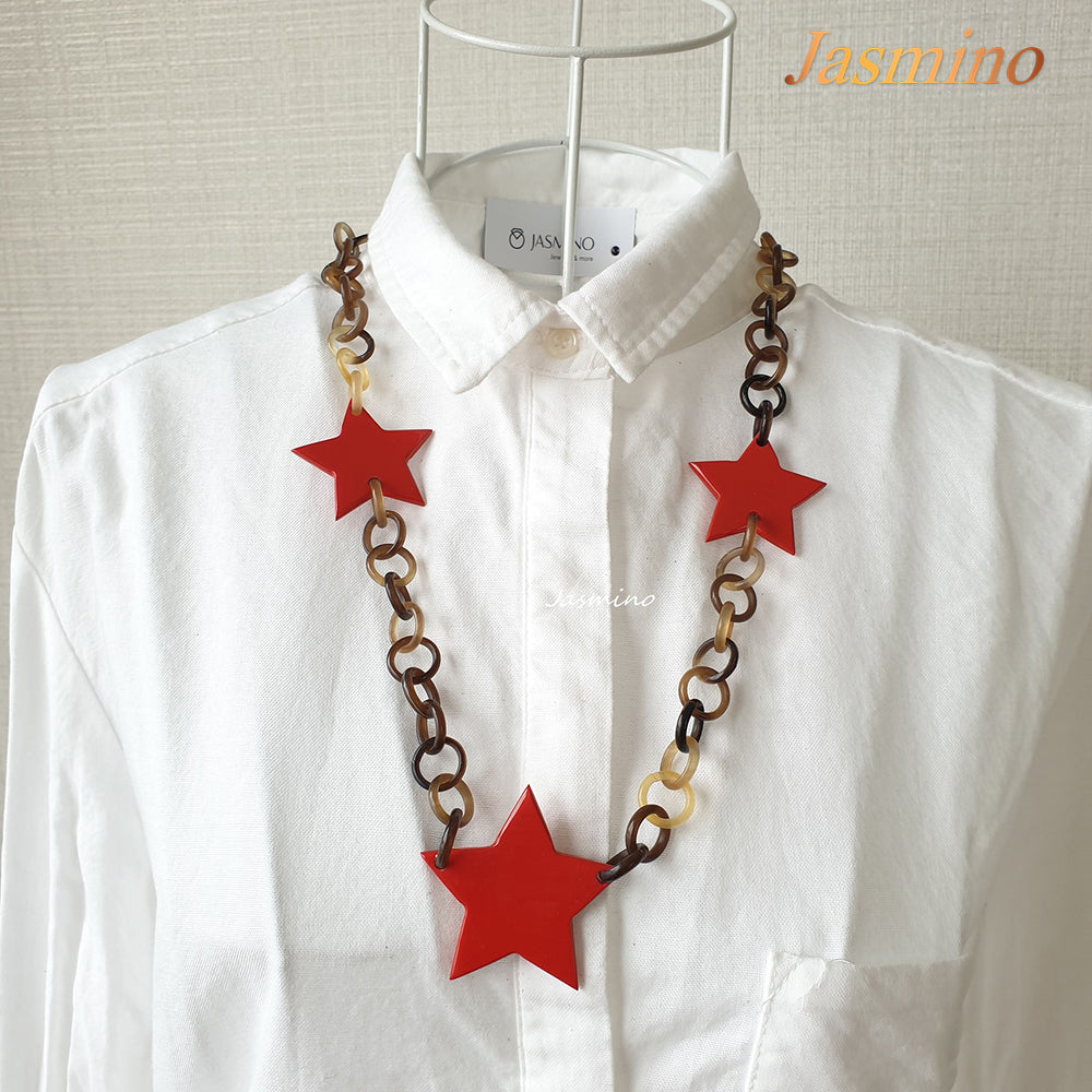 
                  
                    The necklace has several power red triangular in the light background, unique gift for her
                  
                