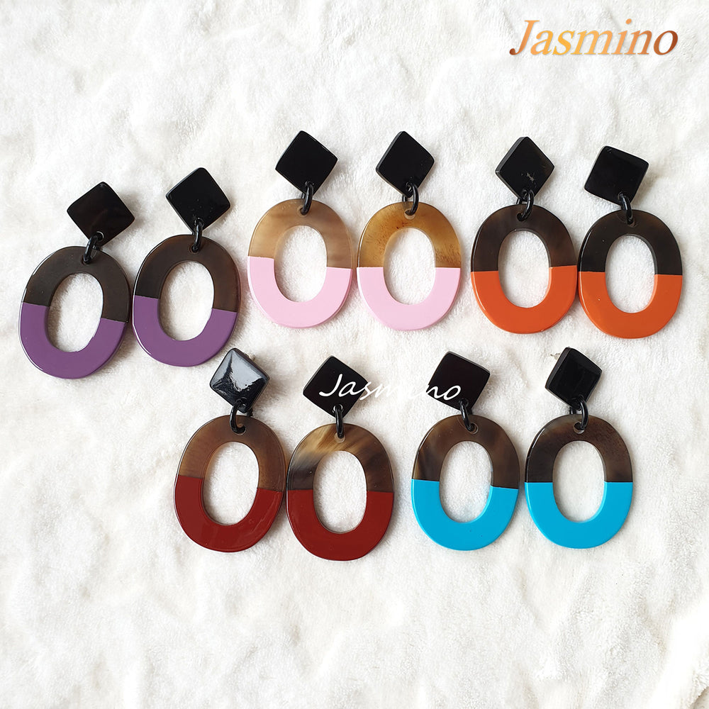 
                  
                    The collection of handmade earrings is made by natural buffalo horn in the natural light
                  
                