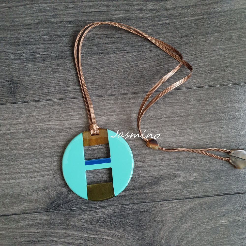 
                  
                    round tuquoise lacquer pendant on the light background, impressive gift for her
                  
                