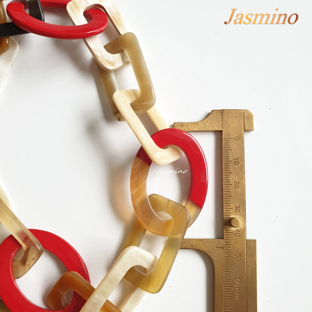 
                  
                    The necklace consists of pieces of natural buffalo horn: circle pieces, rectangle pieces and elliptical flame scarlet pieces connected together with each other, impressive gift for your friend
                  
                