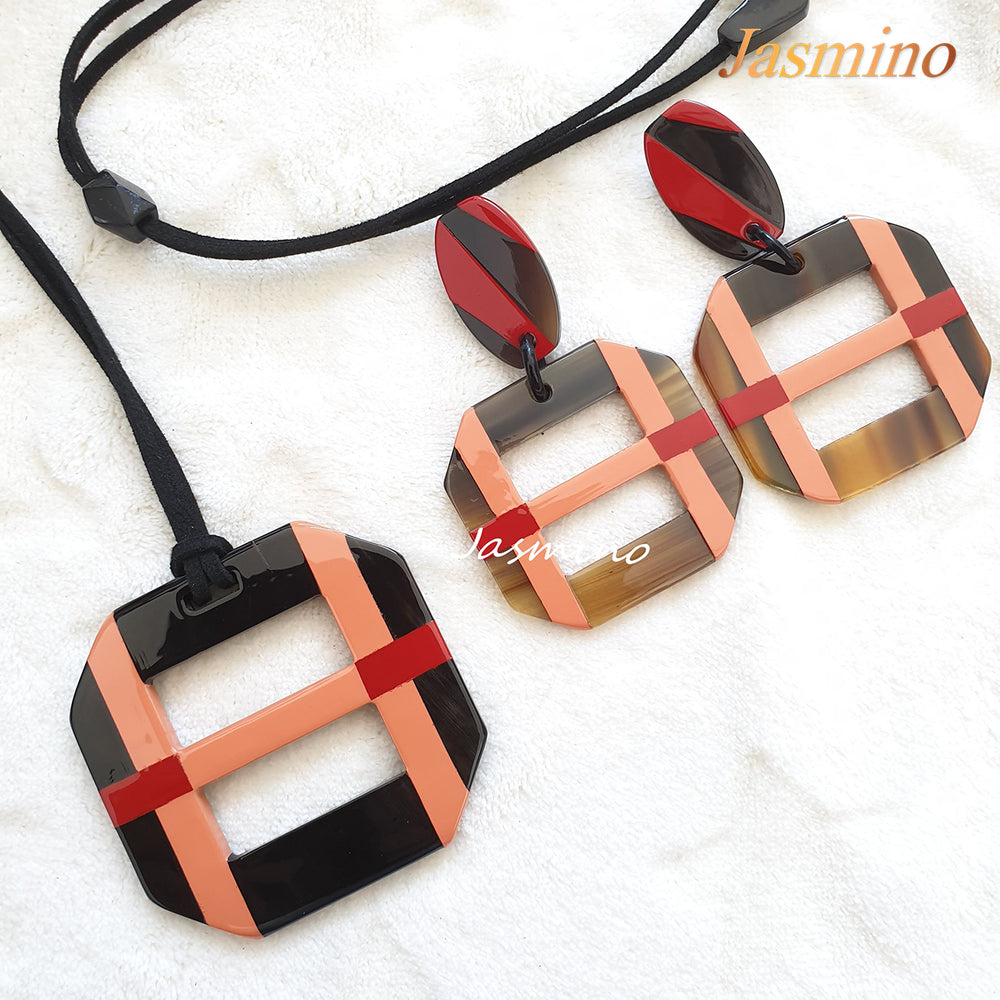 
                  
                    A set of unique handmade Christmas square drop earrings and pendant necklace features pink in natural buffalo horn
                  
                