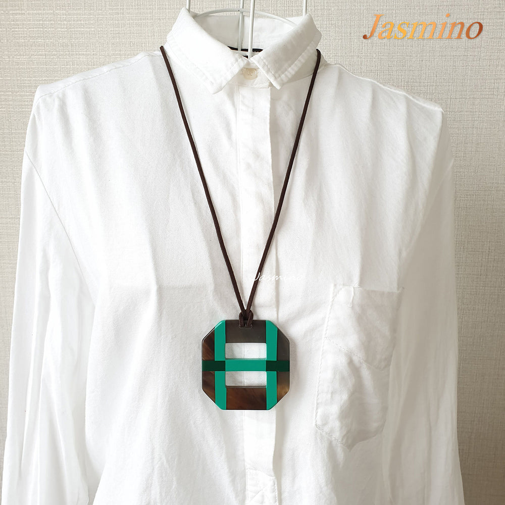 
                  
                    Octagonal pendant with combination of dark green and blue turquoise on natural horn background, impressive gift for her
                  
                