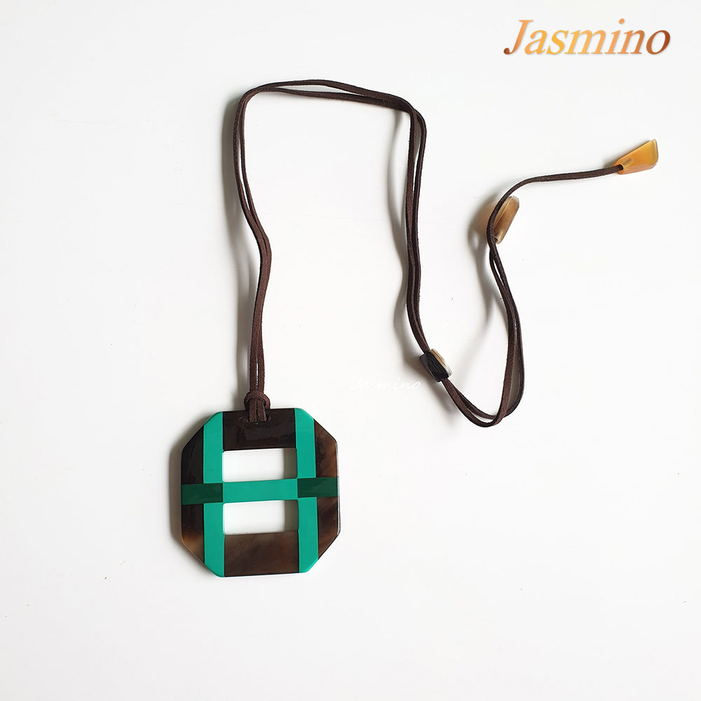 
                  
                    Octagonal pendant with combination of dark green and blue turquoise on natural horn background, impressive gift for her
                  
                
