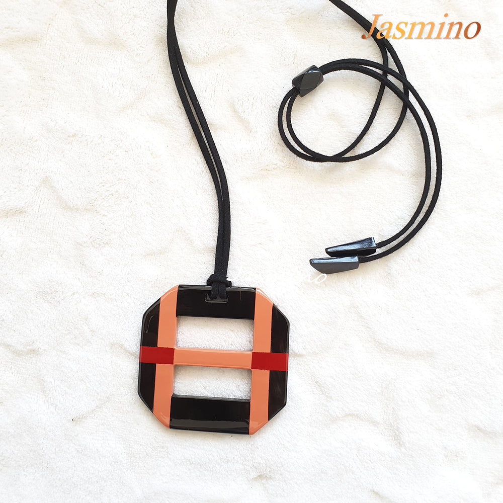 
                  
                    Octagonal pendant with combination of red and salmon on natural horn background, impressive gift for her
                  
                