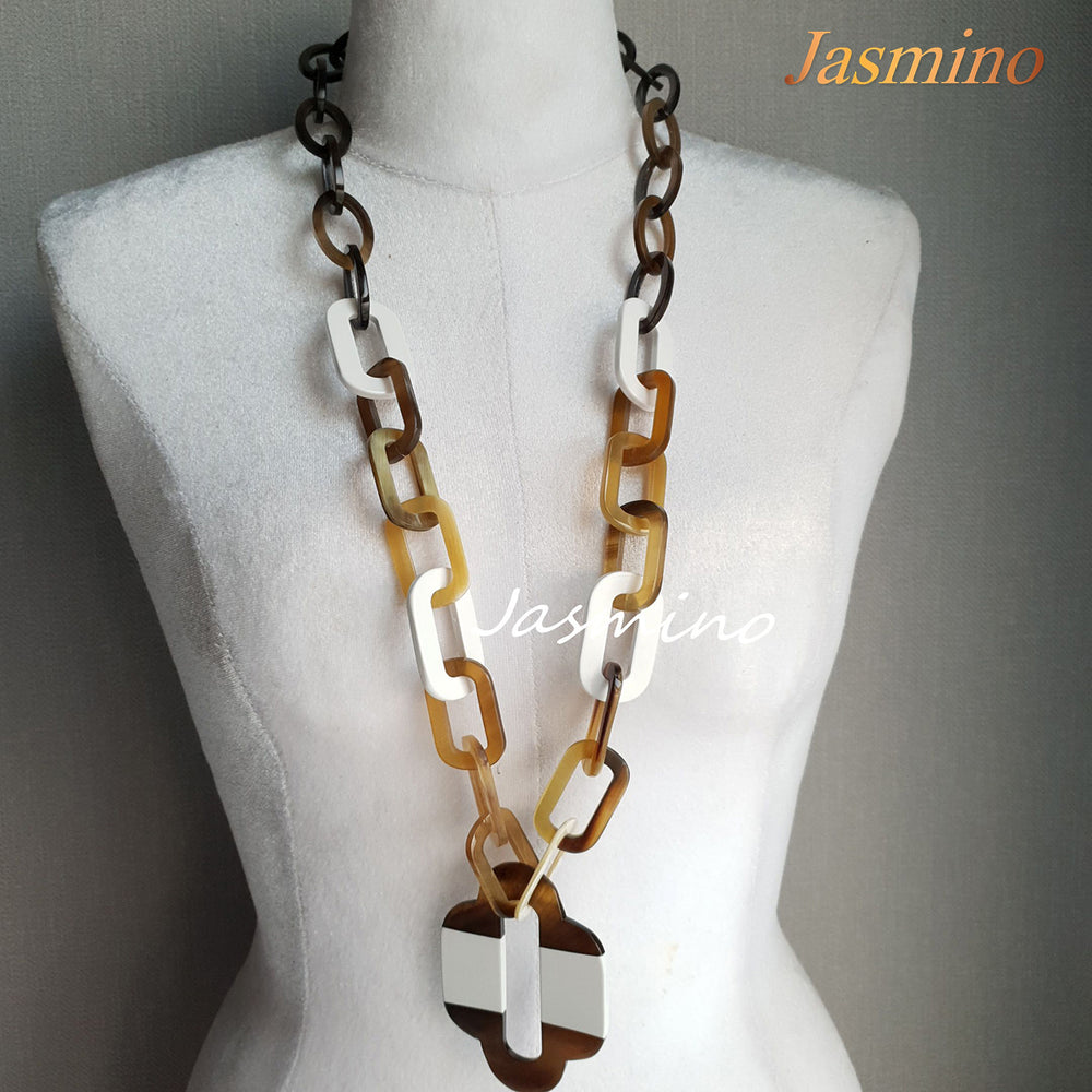 
                  
                    lacquer buffalo horn necklace with trendy brilliant white natural horn pendant in natural light
                  
                