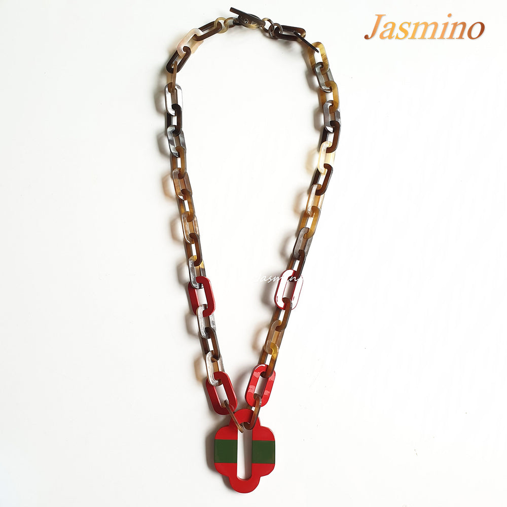 
                  
                    lacquer buffalo horn necklace with trendy flame scarlet natural horn pendant in natural light
                  
                