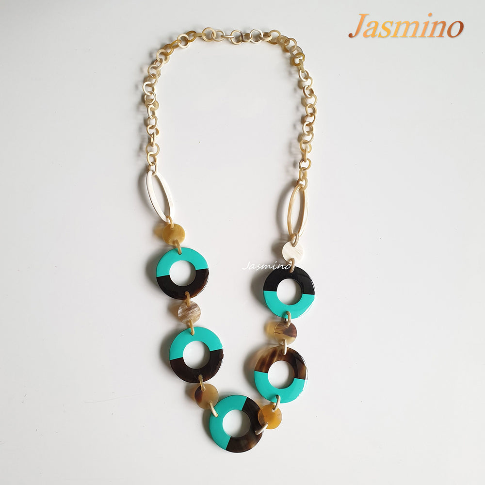 
                  
                    The necklace has large pieces with half natural horn and half biscay green lacquer, unique gift for her
                  
                