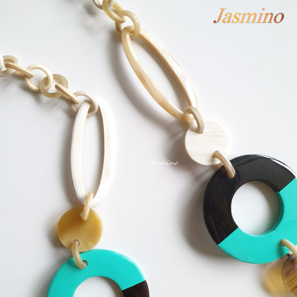 
                  
                    The necklace has large pieces with half natural horn and half biscay green lacquer, unique gift for her
                  
                
