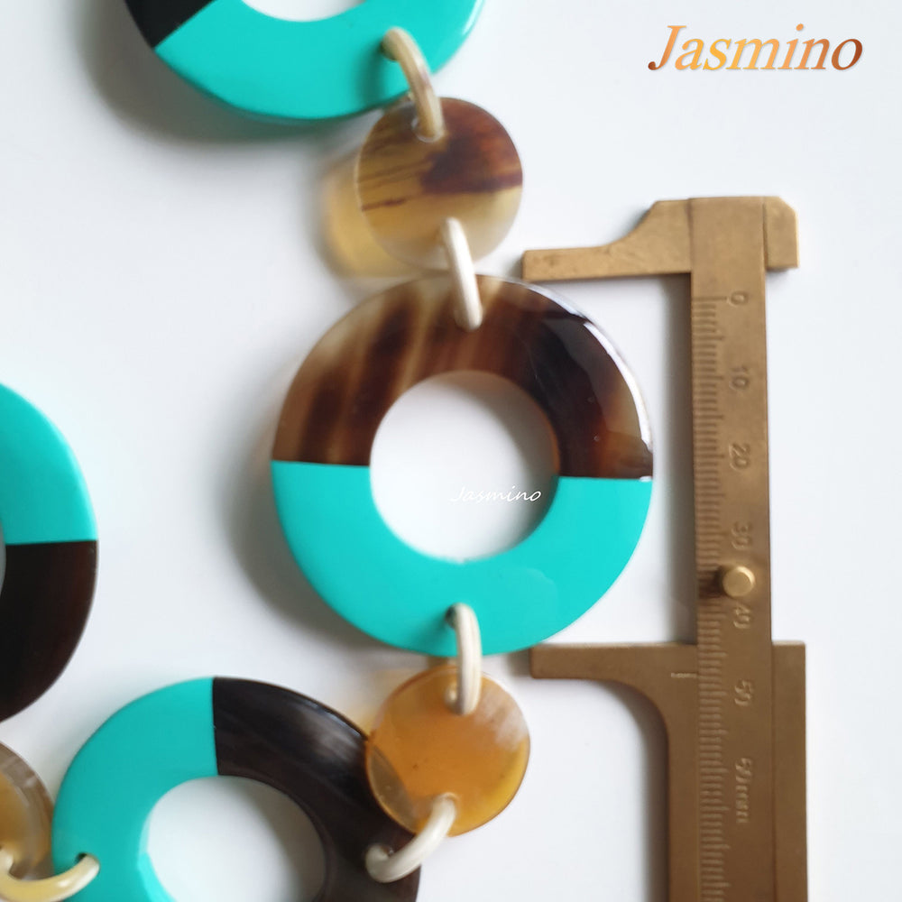 
                  
                    The necklace has large pieces with half natural horn and half biscay green lacquer, unique gift for her
                  
                