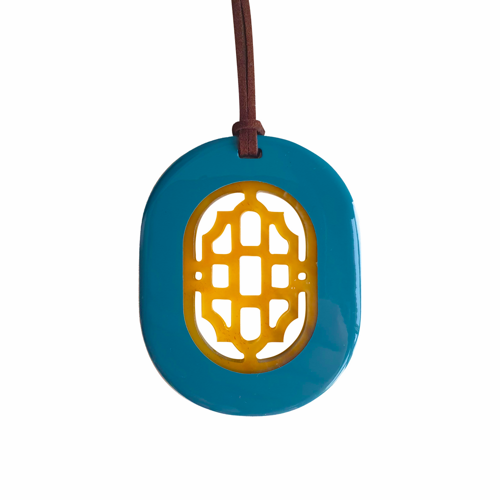 
                  
                    elliptical navy blue lacquer horn pendant with a unique pattern in natural light, impressive gift for her
                  
                