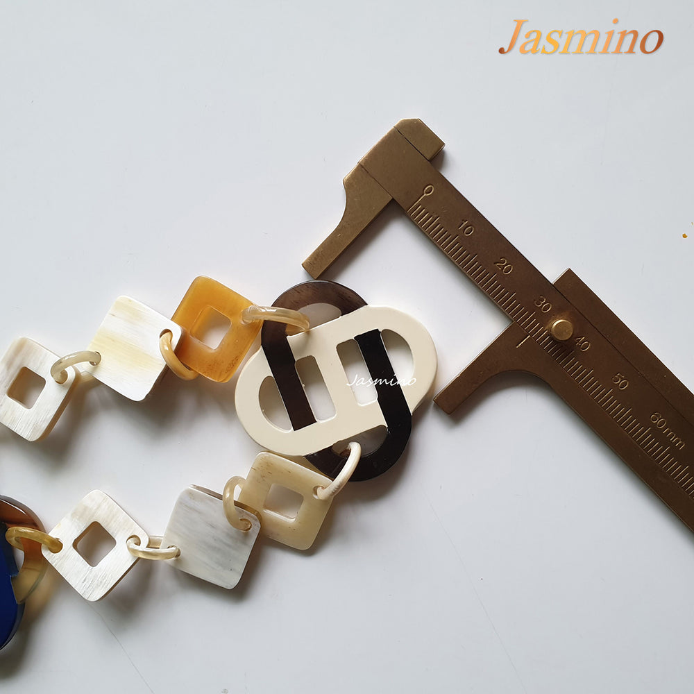 
                  
                    This necklace has several large pieces with different patterns and colors on the light background, unique gift for your friend
                  
                