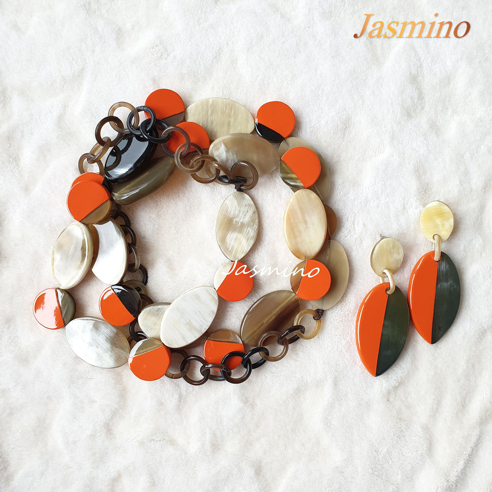 
                  
                    Set of orange peel lacquer buffalo horn jewelry, impressive gift for her on a white background
                  
                