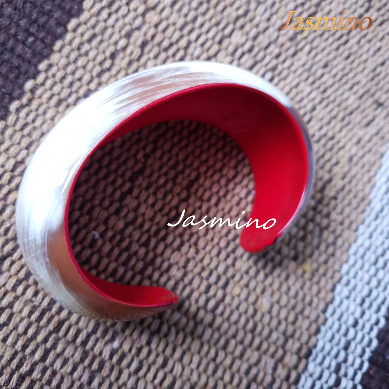 Jasmino unique handmade Vintage white cuff bracelet is shaped a snail shell with a red inside that is made of natural buffalo horn for the best gifts