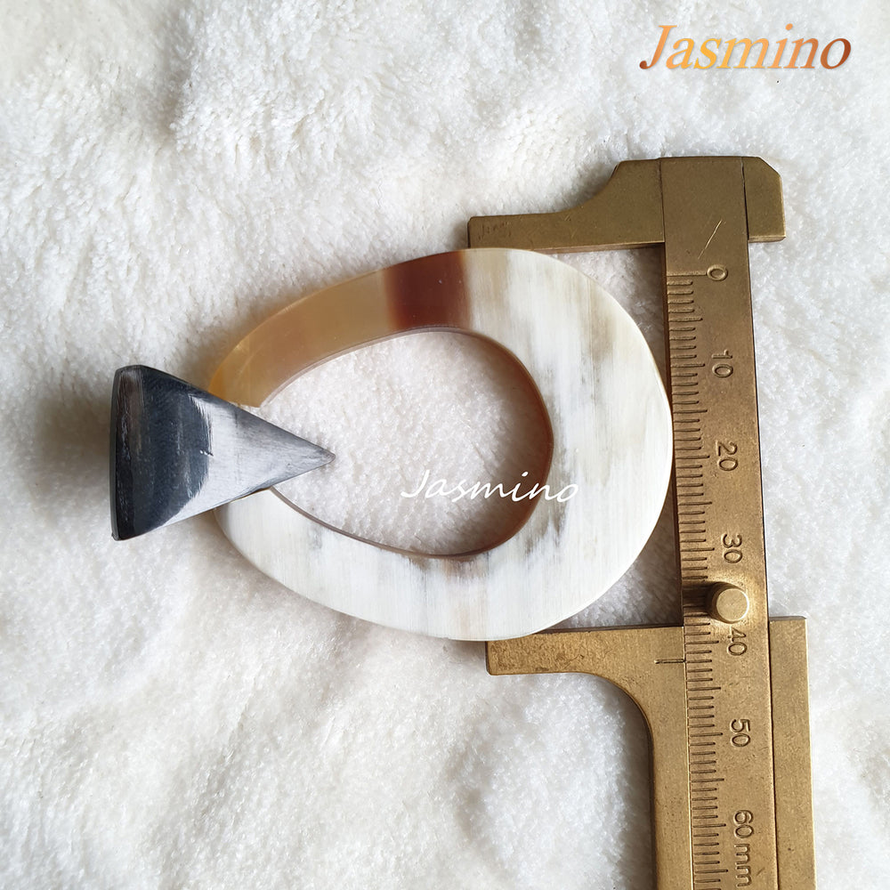 
                  
                    Handmade oval earrings are made of natural buffalo horn with a bright color in the natural light
                  
                