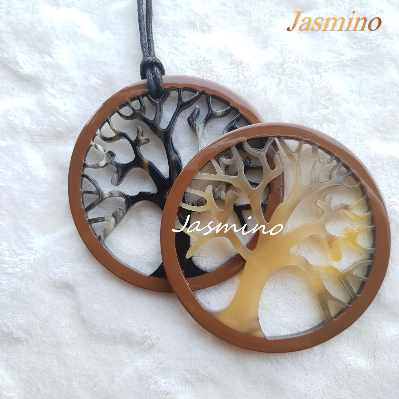 Two circular pendants are designed with brown outline, inside with a tree pattern made of unique natural buffalo horn on a light background, impressive gift for her