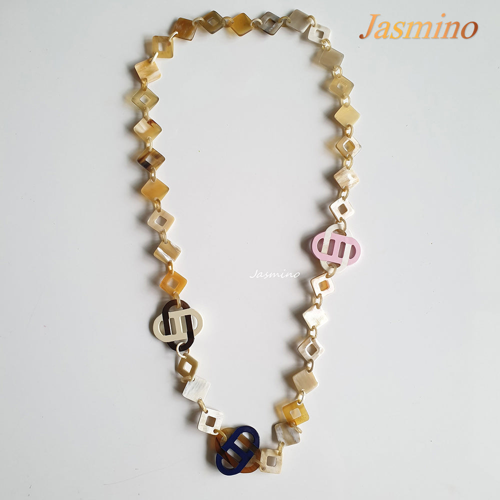 
                  
                    This necklace has several large pieces with different patterns and colors on the light background, unique gift for your friend
                  
                