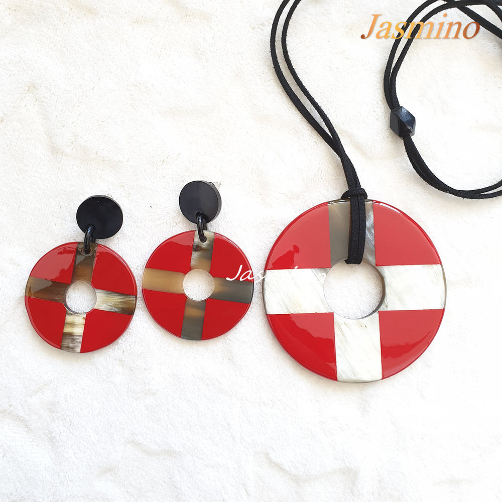 
                  
                    A set of Christmas handmade earrings features a cross and coin shape with red and white color
                  
                