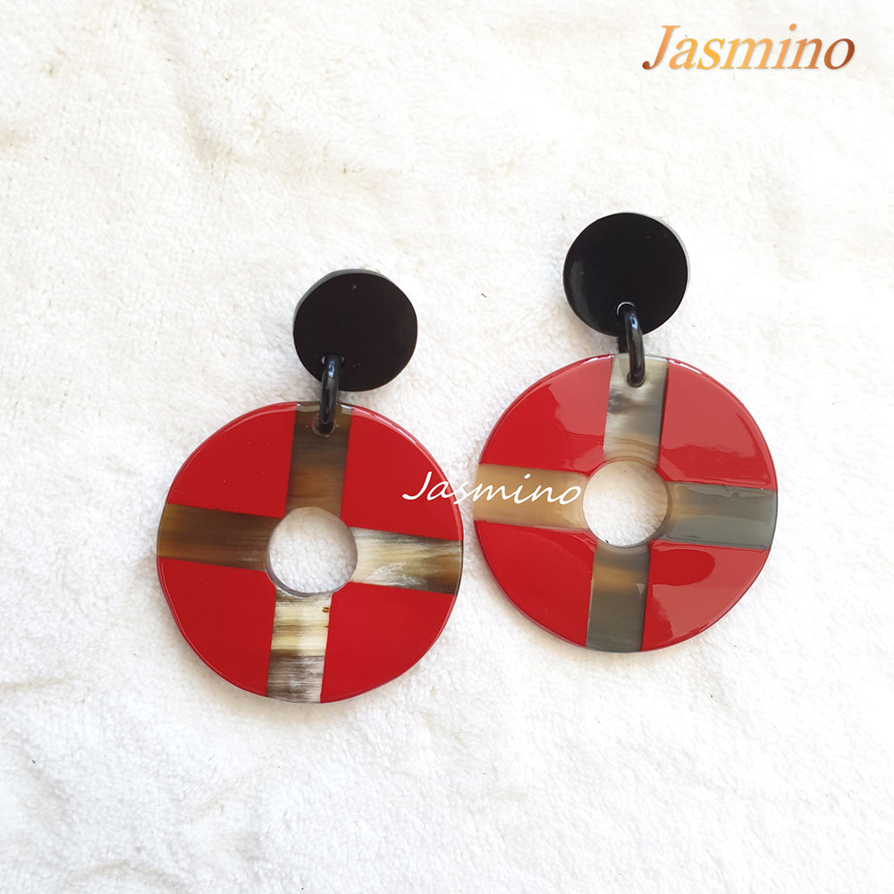 
                  
                    Christmas unique handmade red drop earrings feature a cross and coin shape made of natural buffalo horn
                  
                
