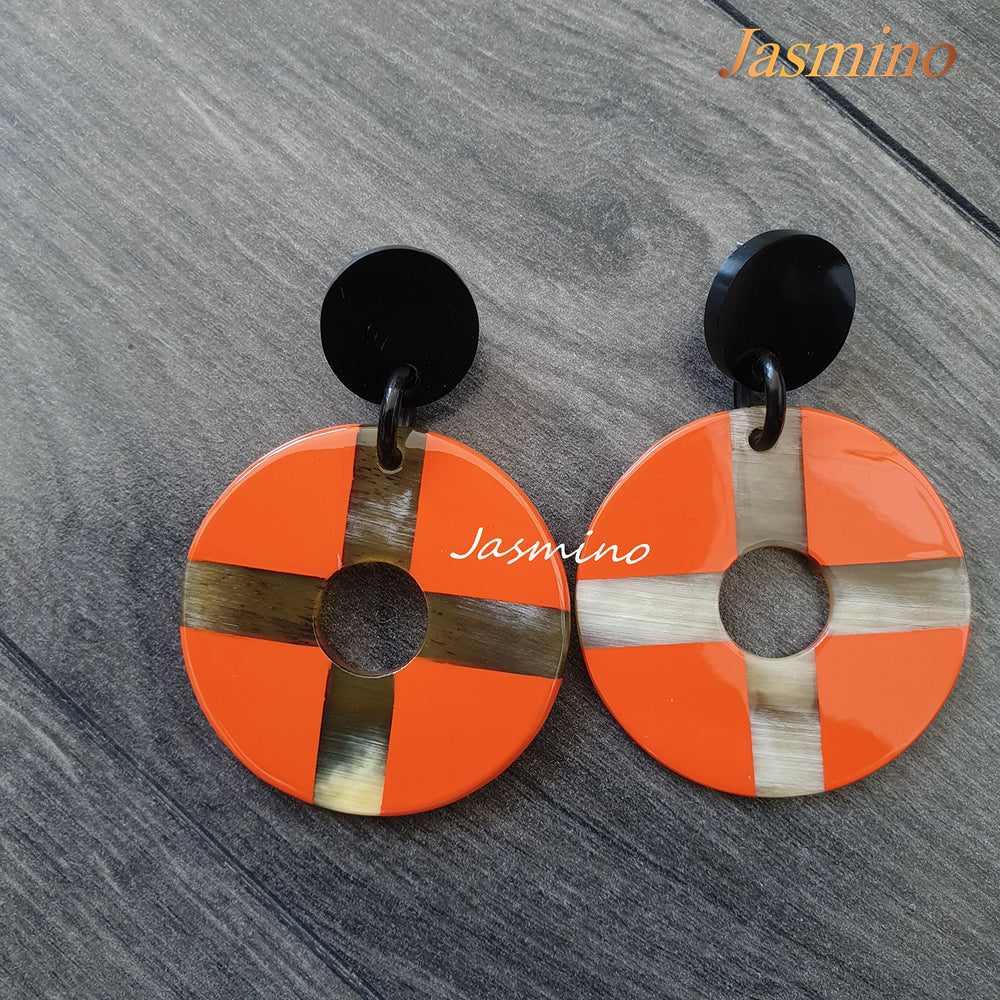 
                  
                    Christmas unique handmade orange drop earrings feature a cross and coin shape made of natural buffalo horn
                  
                