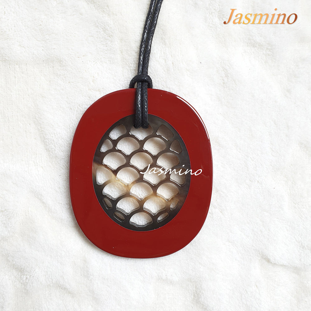 
                  
                    fish scale wine red pendant on the light background, impressive gift for her
                  
                