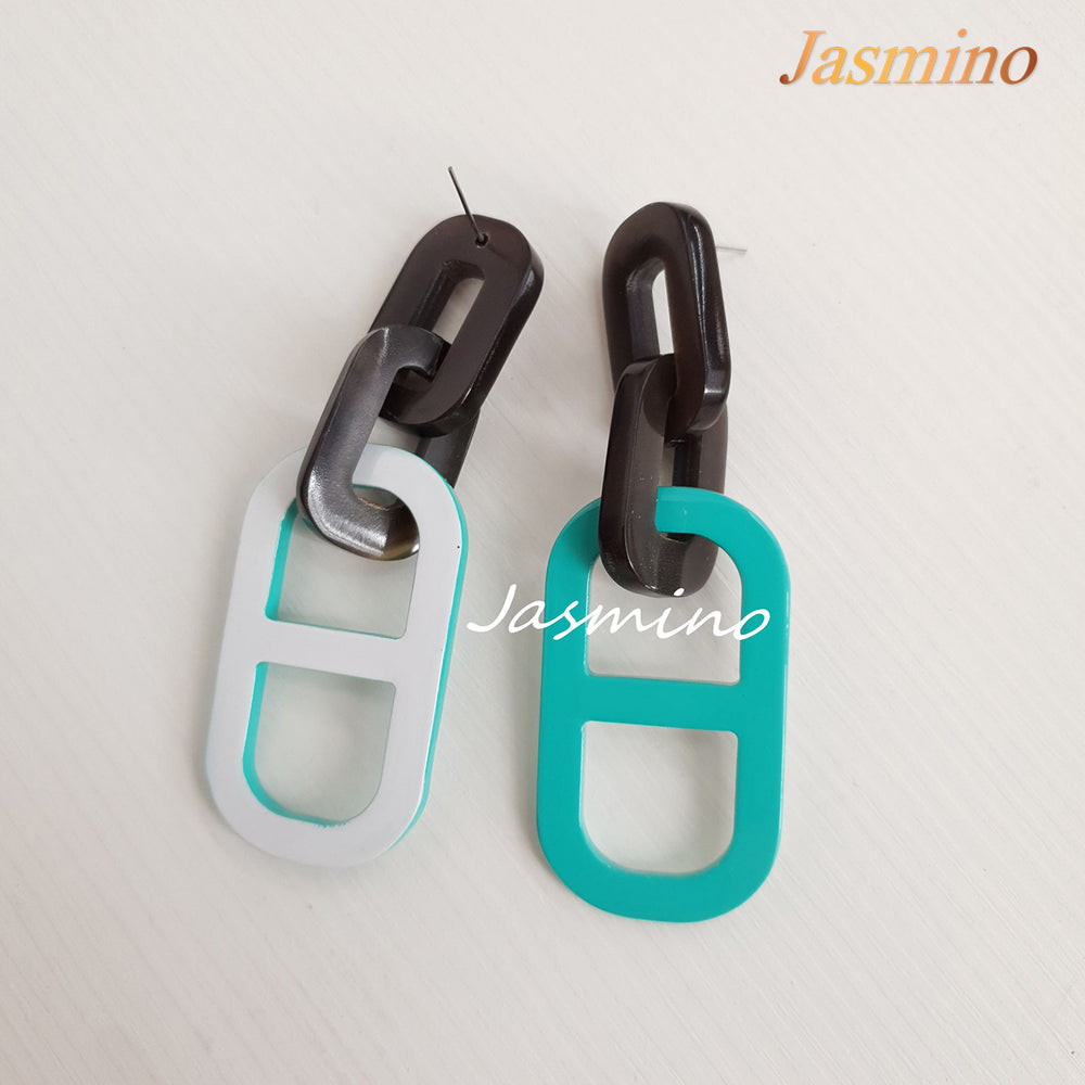 
                  
                    Jasmino unique handmade earrings feature a paperclip shape with turquoise and white color made of natural buffalo horn
                  
                