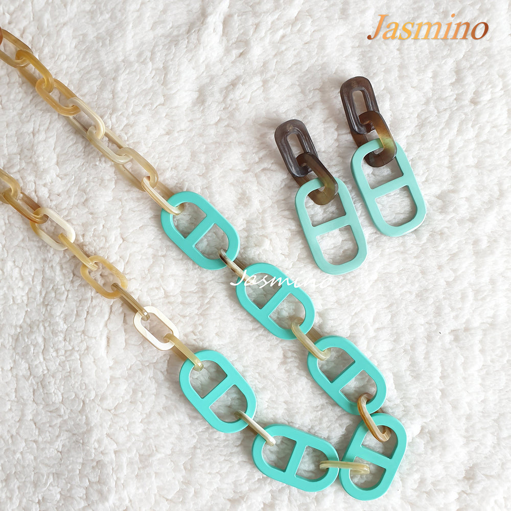 
                  
                    A set of a pair of turquoise handmade earrings and necklace features turquoise made of natural buffalo horn 
                  
                