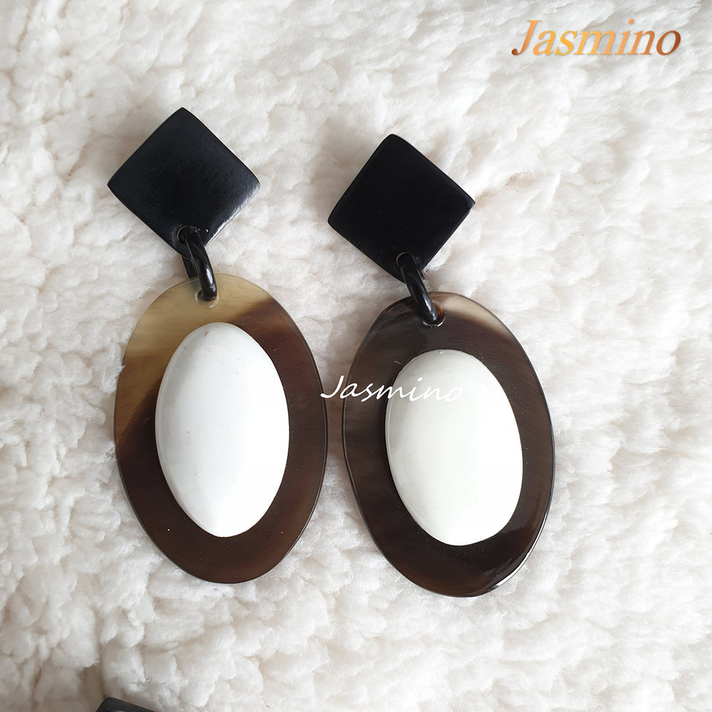 
                  
                    Jasmino unique handmade Bohemian mermaid beach oval drop earrings feature white and brown made of natural buffalo horn
                  
                