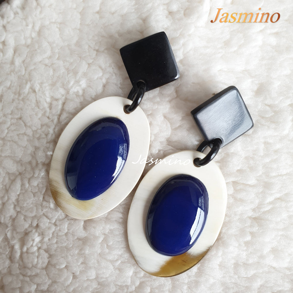
                  
                    Jasmino unique handmade Bohemian mermaid beach oval drop earrings feature classic blue and white made of natural buffalo horn
                  
                