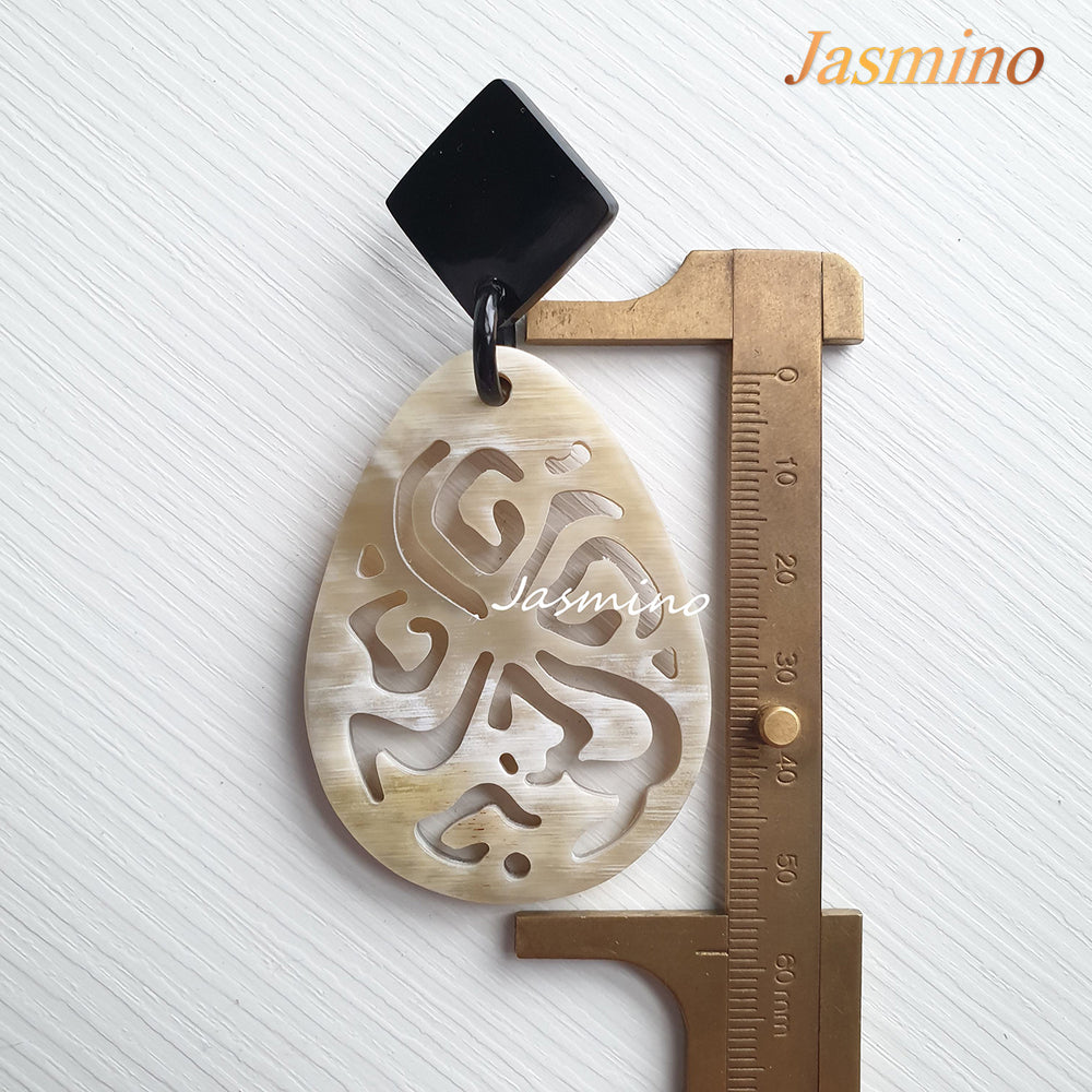 
                  
                    Jasmino unique handmade white large oval drop earrings are inspired by a spider for Halloween costumes and parties
                  
                