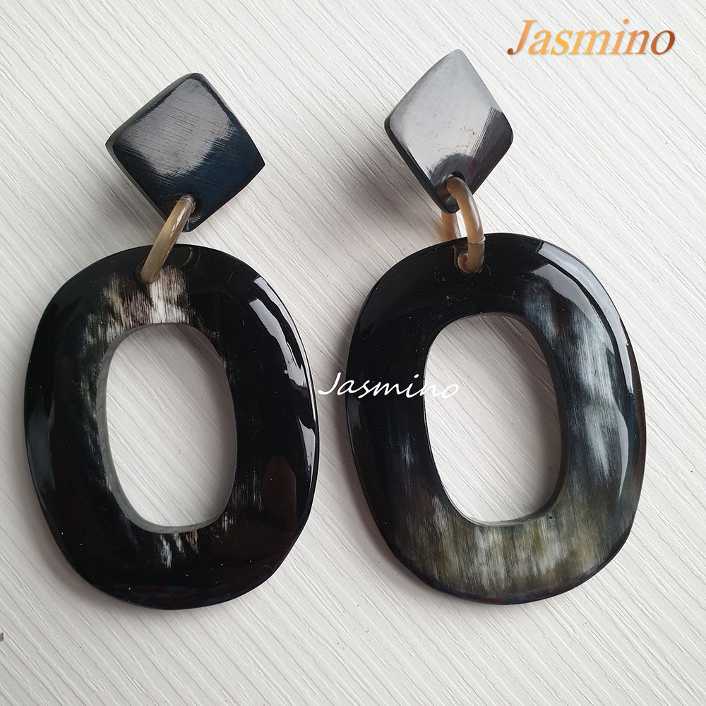 
                  
                    Jasmino unique handmade large oval drop earrings feature black made of natural buffalo horn
                  
                