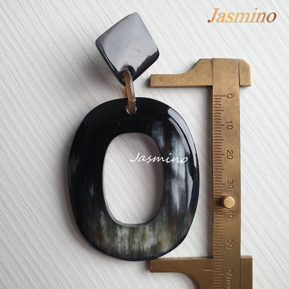 
                  
                    Jasmino unique handmade large oval drop earrings feature black made of natural buffalo horn
                  
                
