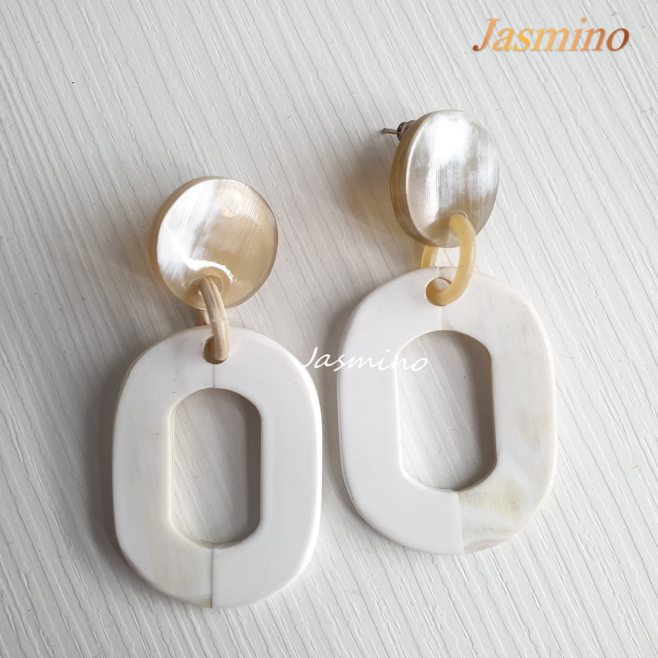 the earrings are designed with half natural horn and half brilliant white lacquer, unique gift for her