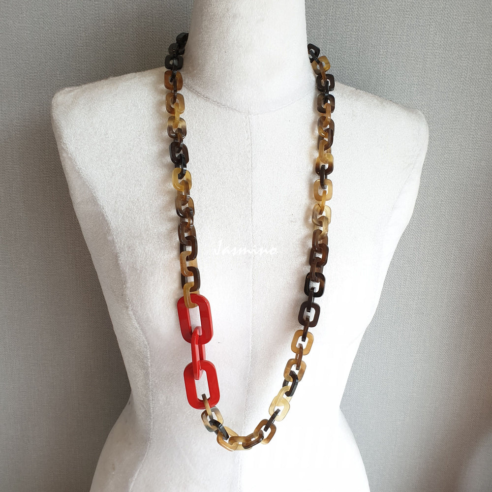 
                  
                    The necklace is made from natural buffalo horn pieces with three big horn pieces are painted orange peel, unique gift for your friend 
                  
                