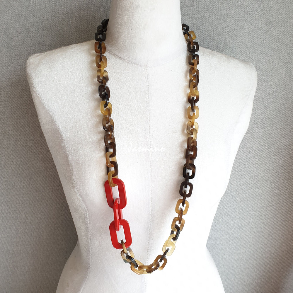 
                  
                    The necklace is made from natural buffalo horn pieces with three big horn pieces are painted orange peel, unique gift for your friend 
                  
                