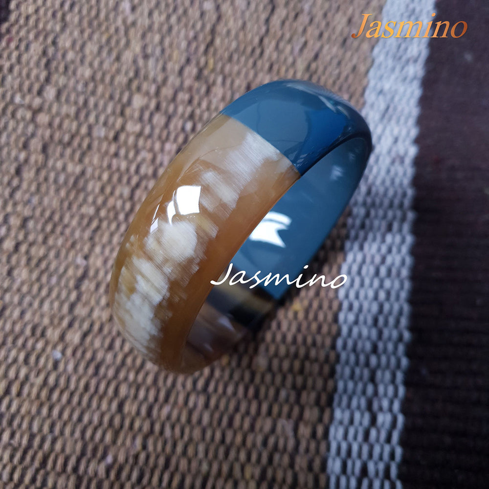 
                  
                    Buffalo horn bangle with half natural horn and half painted cadet blue on the light background, impressive gift for her
                  
                