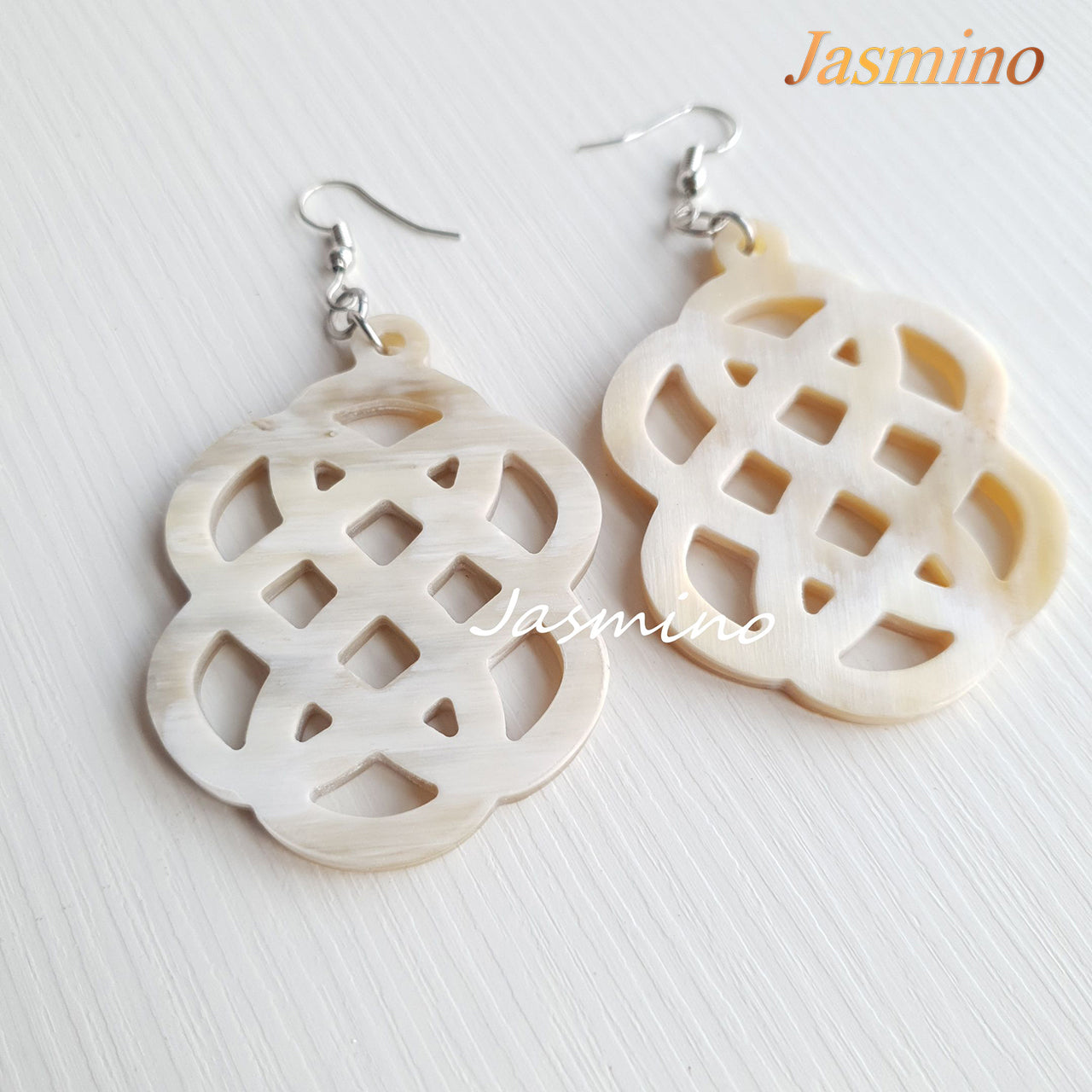 The unique handmade earrings are designed with a solid white color, unique gift for her and Christmas