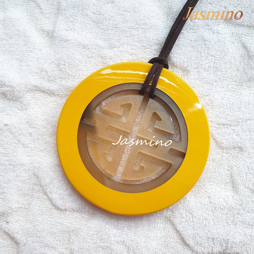 
                  
                    yellow lacquer pendant on the light background, impressive gift for her
                  
                