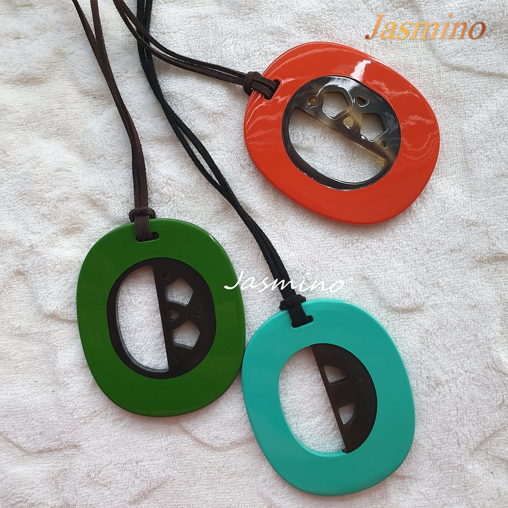 
                  
                    three unique handmade oval pendants are made of natural buffalo horn for Thanksgiving and Christmas gifts
                  
                