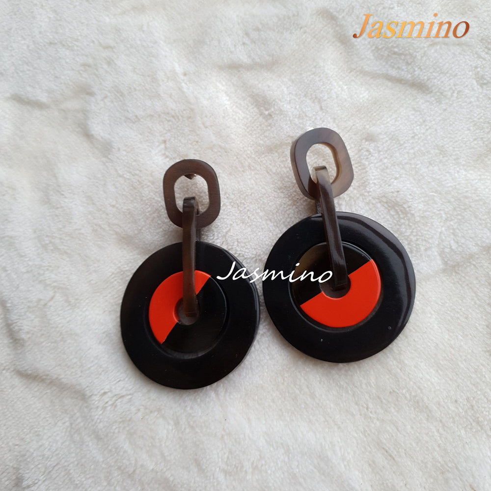 
                  
                    Jasmino Unique Tire Drop Earrings For Men And Women Featured Black And Burnt Orange
                  
                