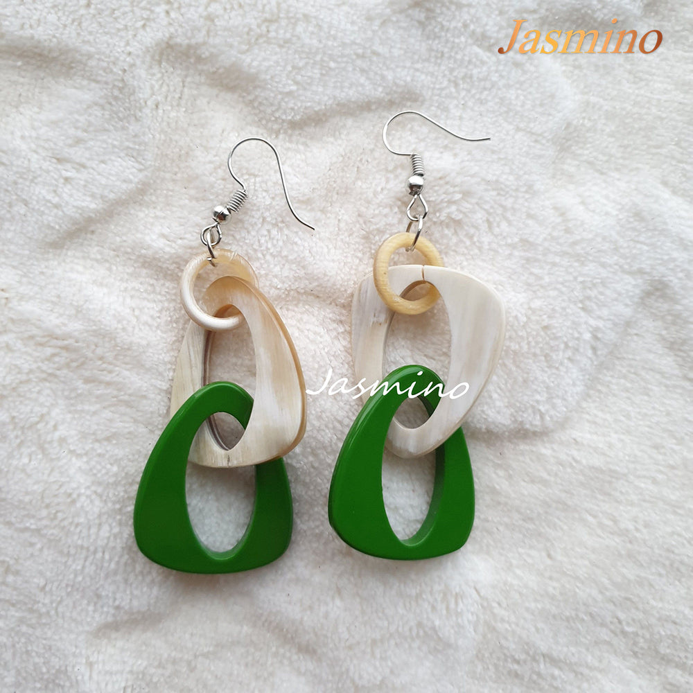
                  
                    Handmade triangle dangle earrings are designed by emerald and white color for Christmas decor
                  
                