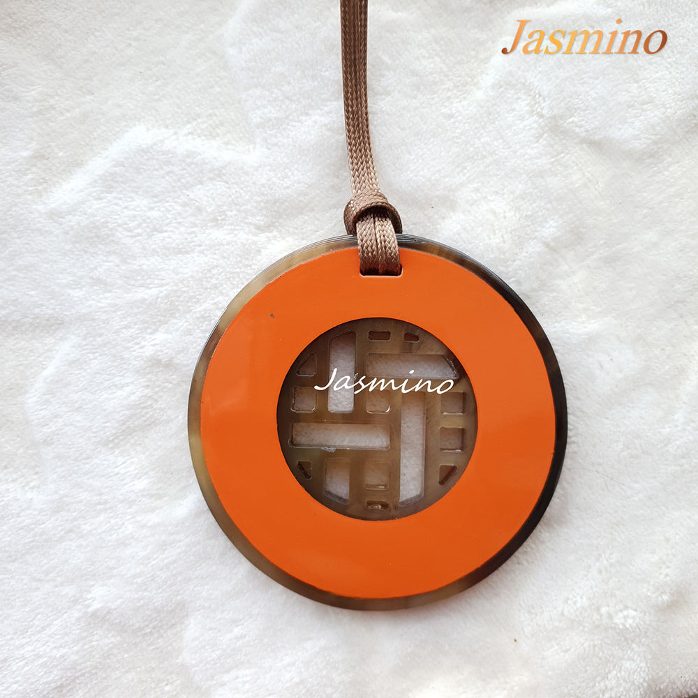 
                  
                    circle iced mango buffalo horn pendant 8cm on the light background, impressive gift for her
                  
                