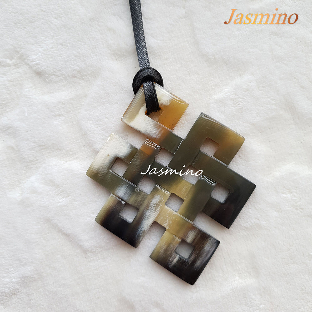 
                  
                    unique lozenge natural buffalo horn pendant on the light background, impressive gift for her
                  
                