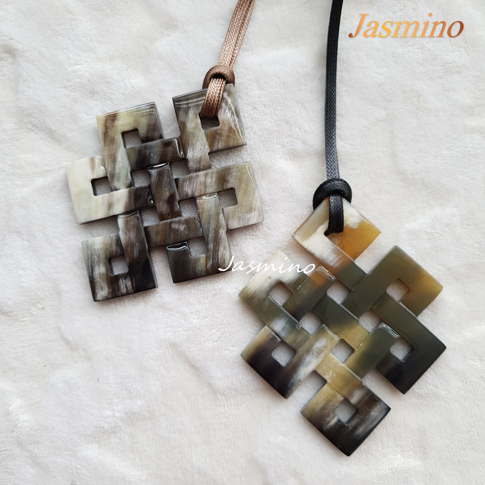 
                  
                    unique lozenge natural buffalo horn pendants on the light background, impressive gift for her
                  
                